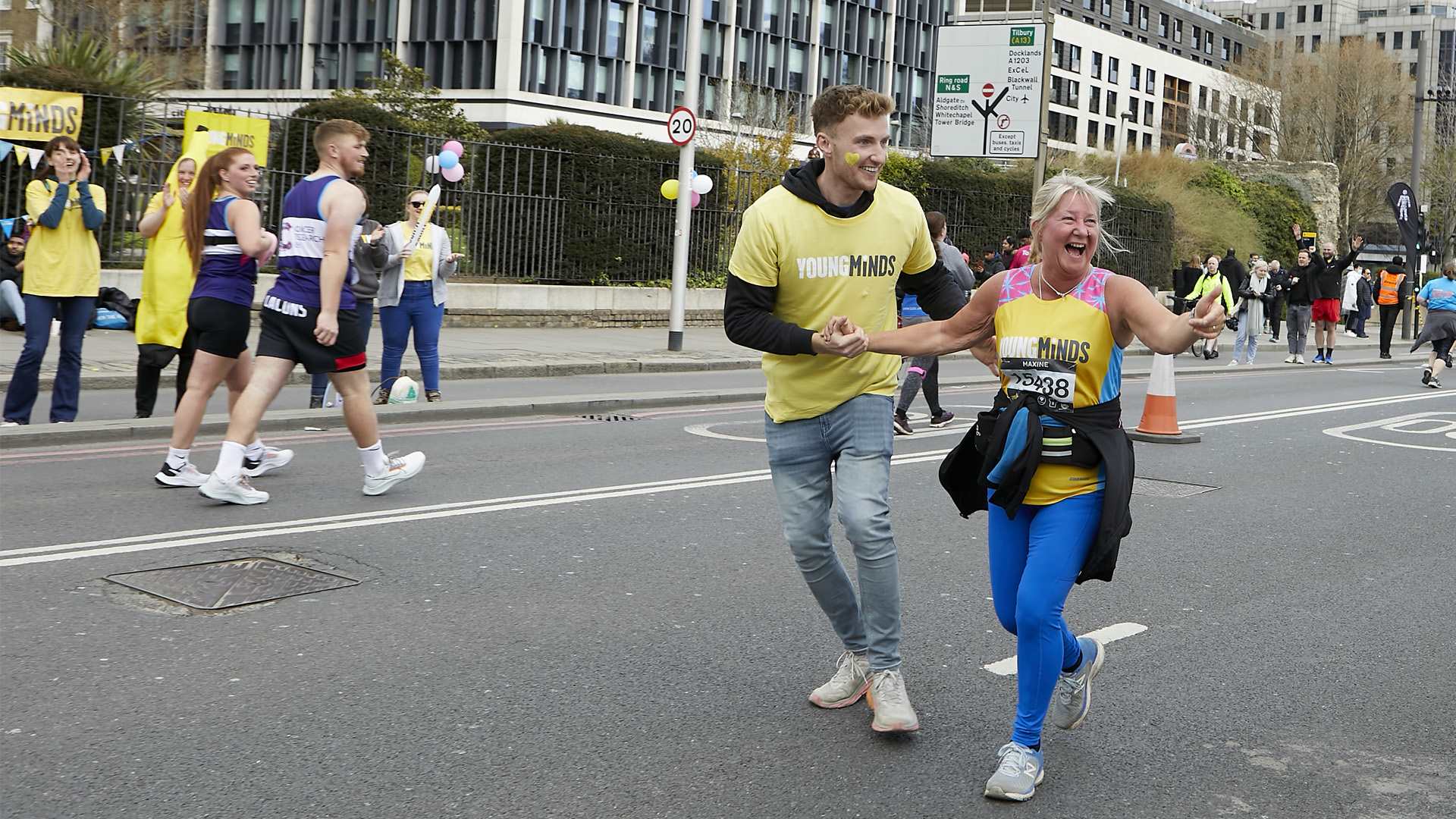 Our fundraiser, Maxine Langton, running the London Marathon wearing a YoungMinds running vest.