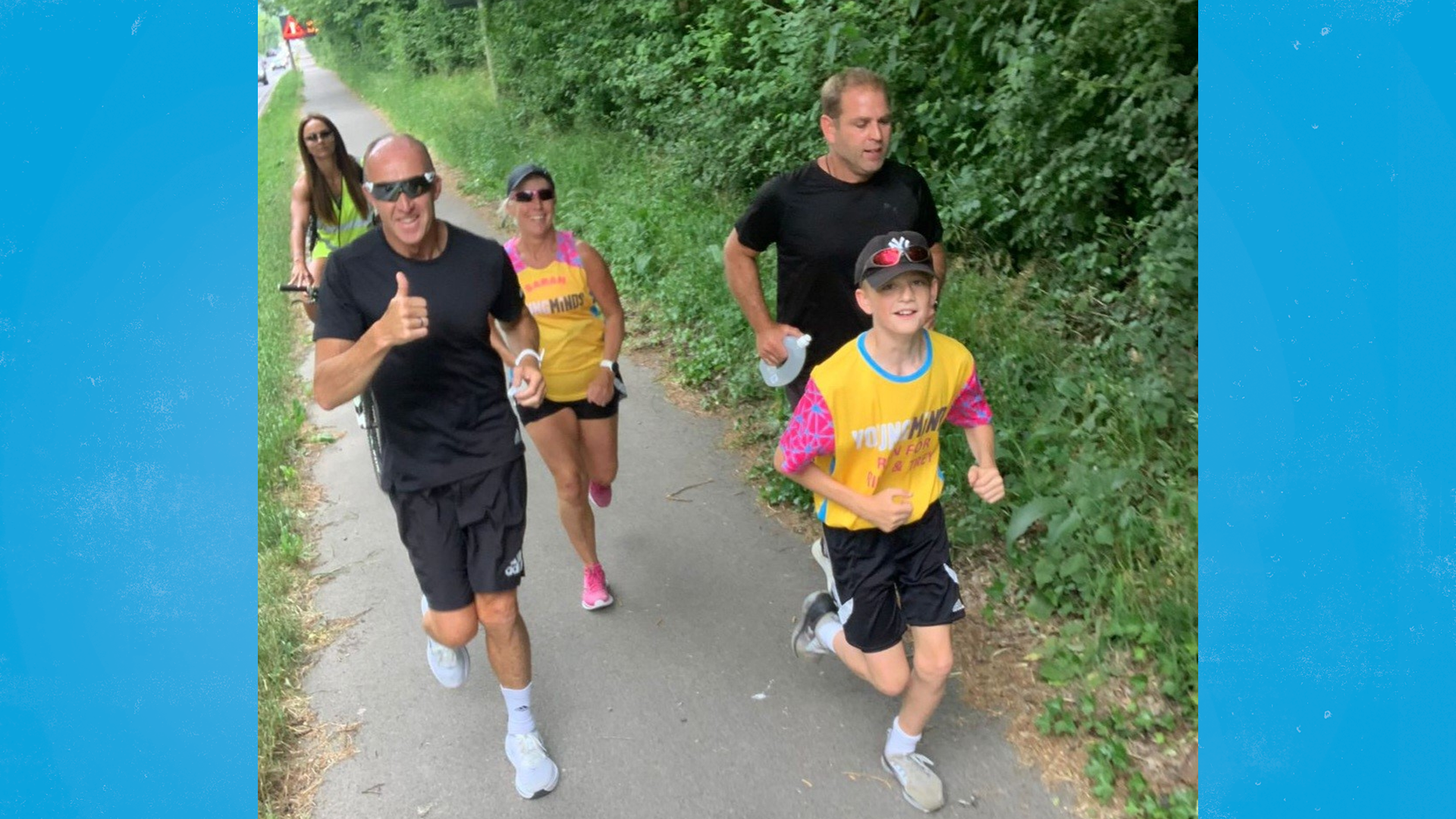 Alfie and Mike running, joined by Alfie's PE teacher and others who ran to show their support.
