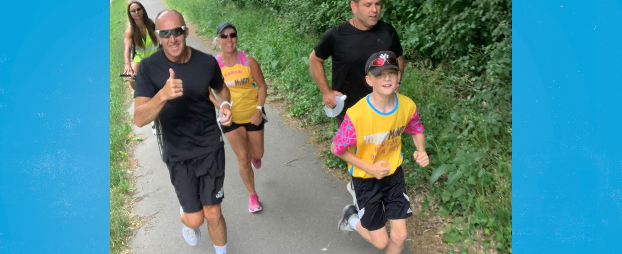 Alfie and Mike running, joined by Alfie's PE teacher and others who ran to show their support.
