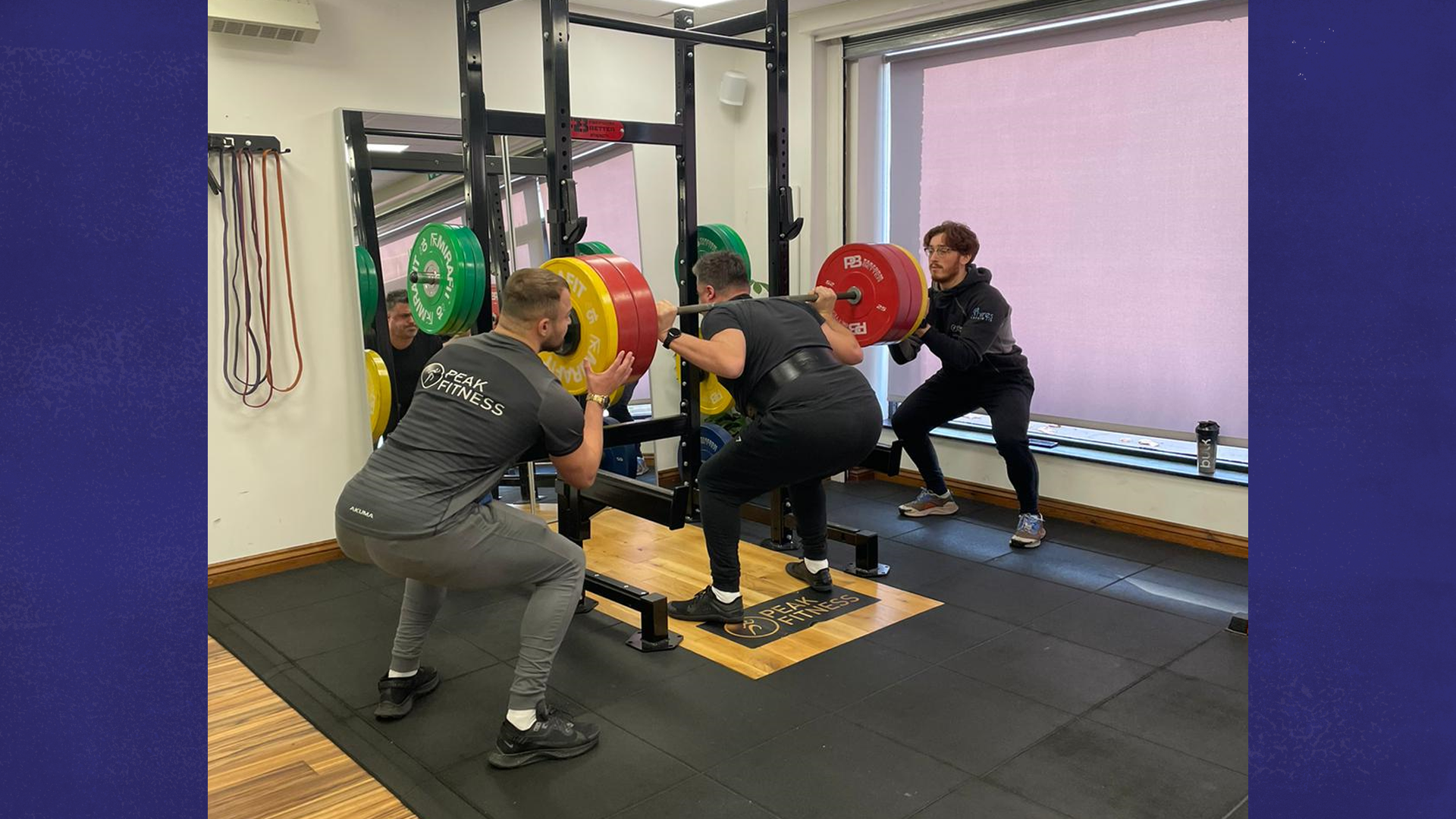 Craig lifting a heavyweight at the gym.