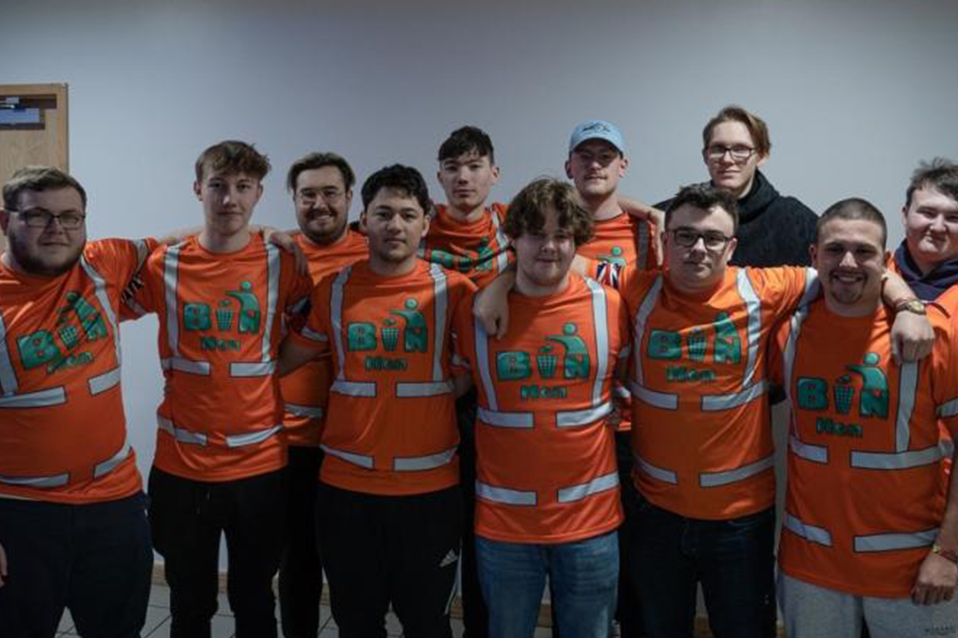 The Binmen group with their arms around each other.