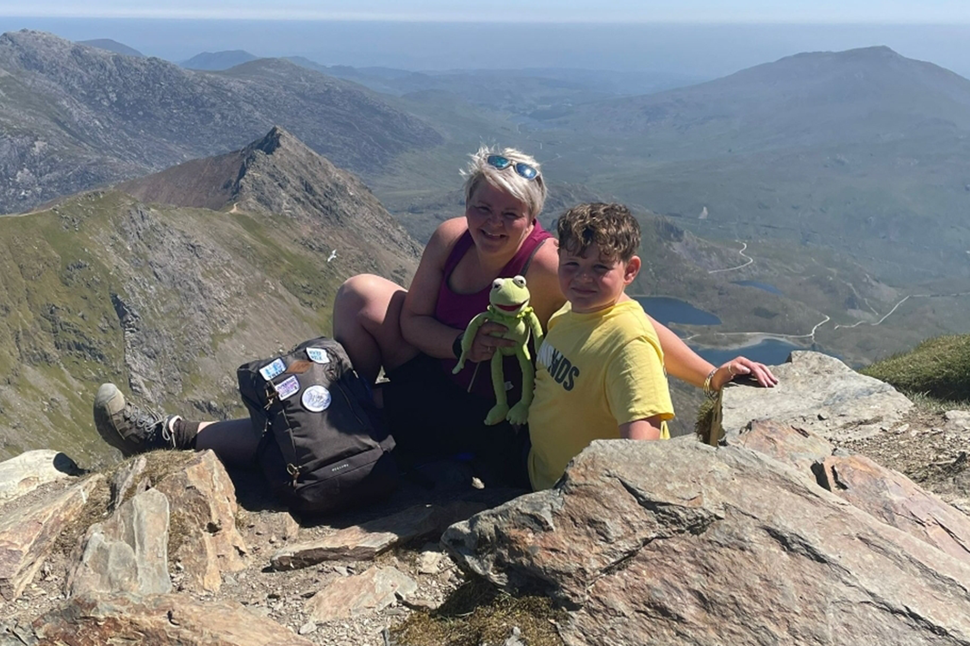 Flynn and his mum on the Snowdon mountain with a Kermit the frog toy.