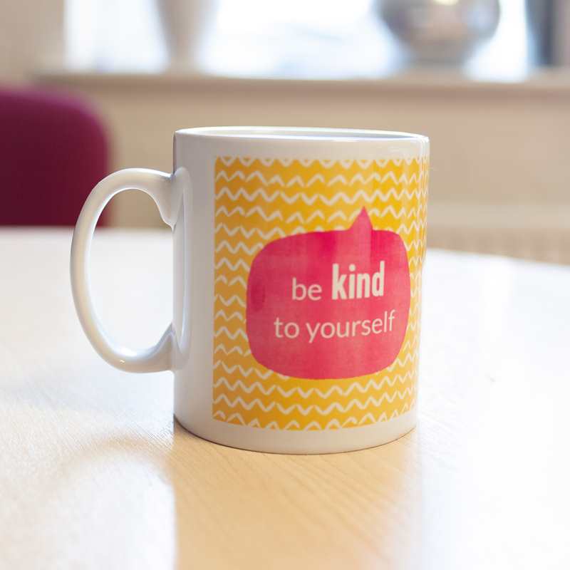 YoungMinds mug with be kind to yourself text