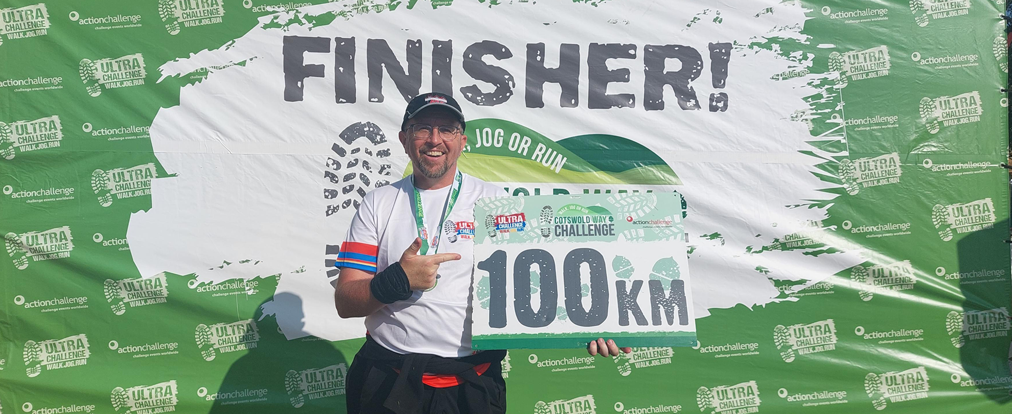 Tony holding his certificate at the end of the challenge.
