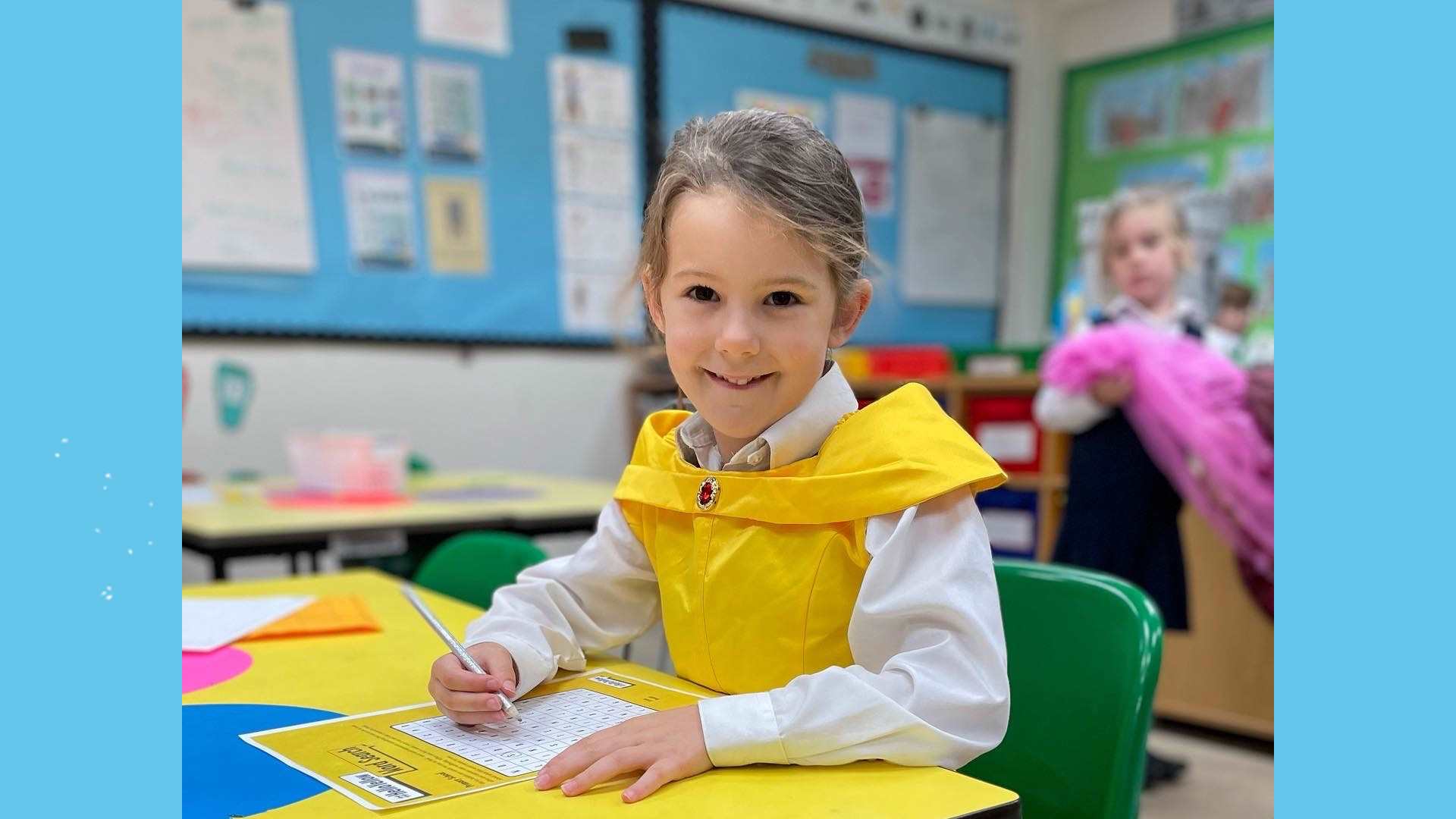 A primary school child doing a #HelloYellow word search and wearing a yellow dress.