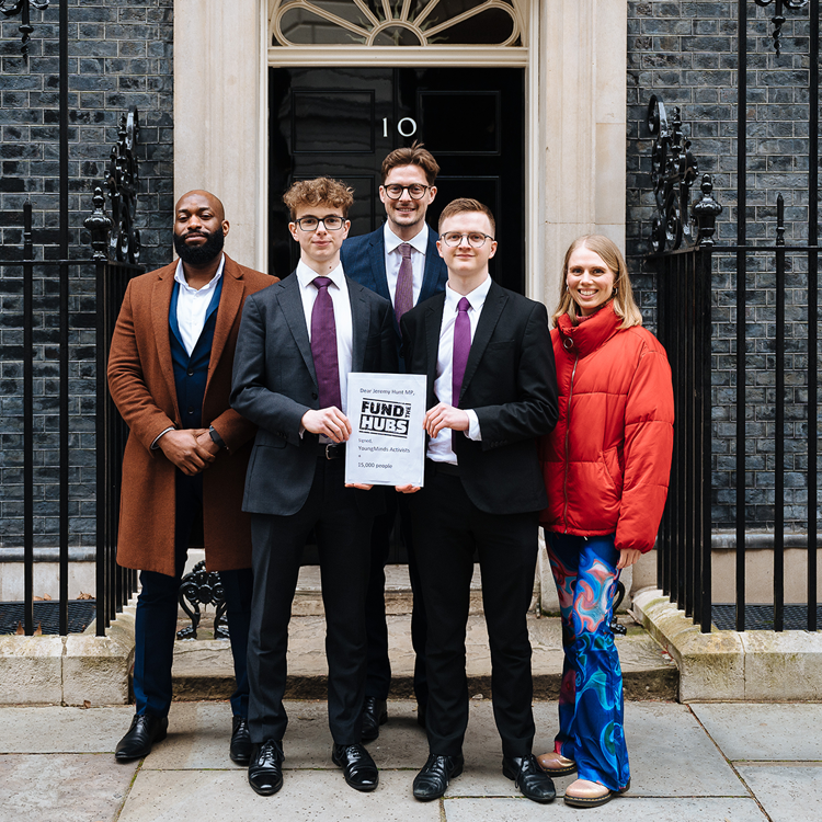 Activists stand in front of Number 10 Downing Street with their letter for Jeremey Hunt.